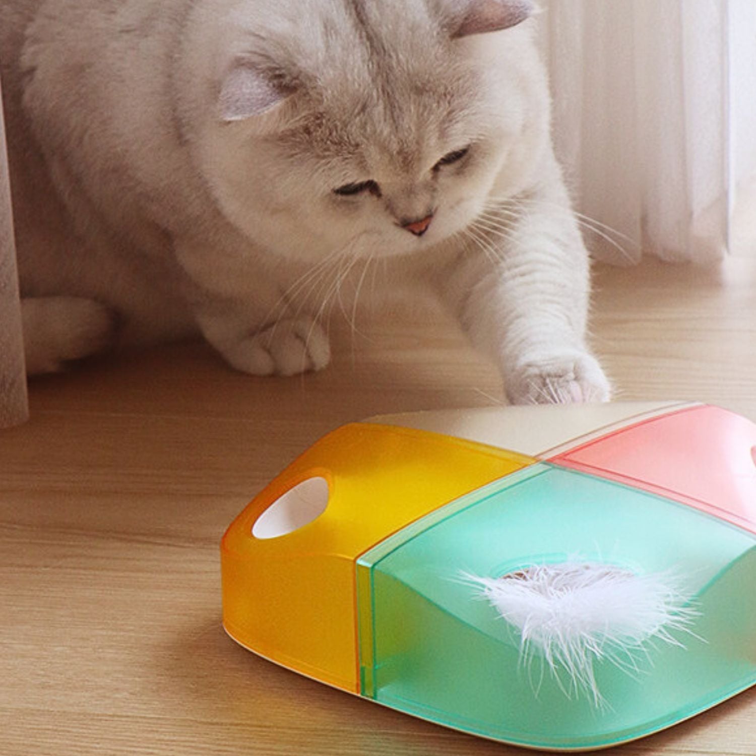 Slimme Kattenveer Speelgoed Witte doos uitstralend warm geel oranje en rood licht